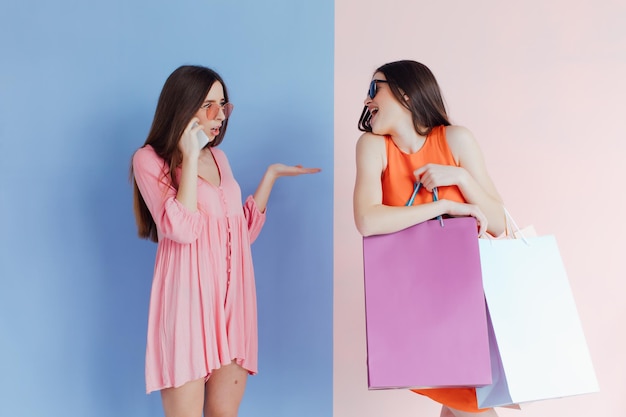 happy women with shopping bags