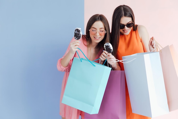 happy women with shopping bags