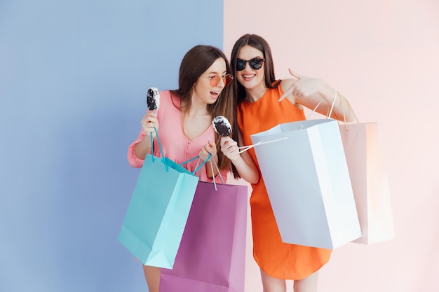 happy women with shopping bags