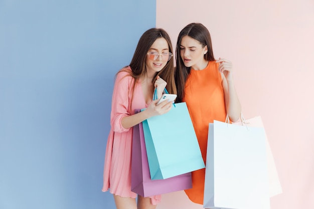 happy women with shopping bags