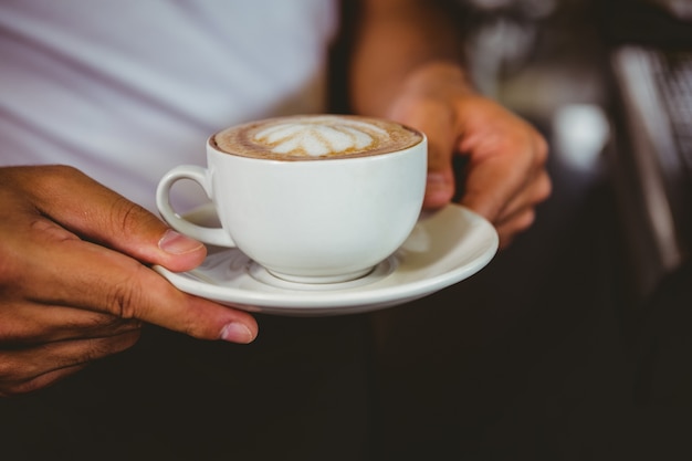 happy worker making coffee