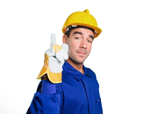 Happy worker with number one gesture on white background