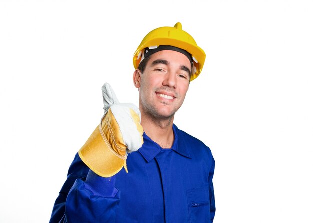 Happy worker with an okay gesture on white background