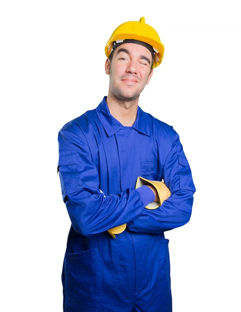 Happy workman winking an eye on white background