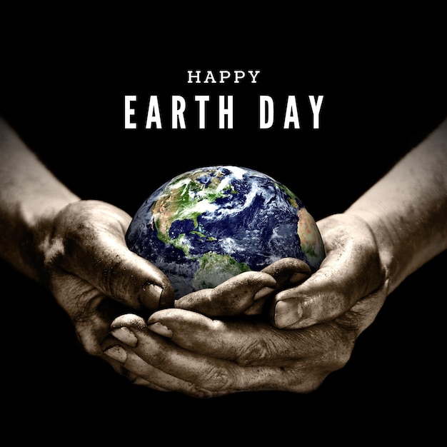 Photo happy world earth day holding world in hand poster