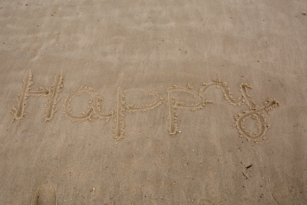 Happy writting in  a sand at summer