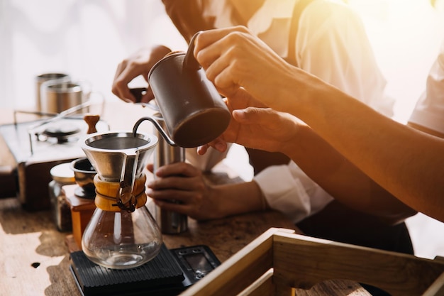 Photo happy young adult couple making breakfast and drinking coffee together in cozy home kitchen in morning at home preparing meal and smiling lifestyle leisure and love concept