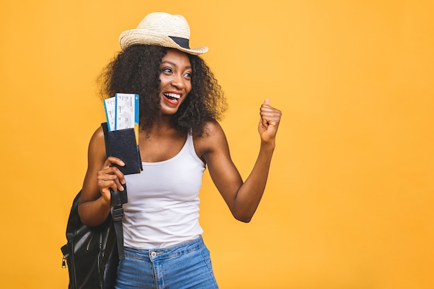 happy young african american black woman with air tickets