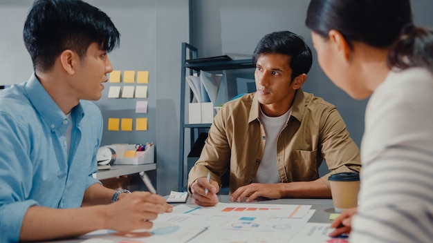 happy young asia businessmen and businesswoman meeting brainstorming some new ideas about project