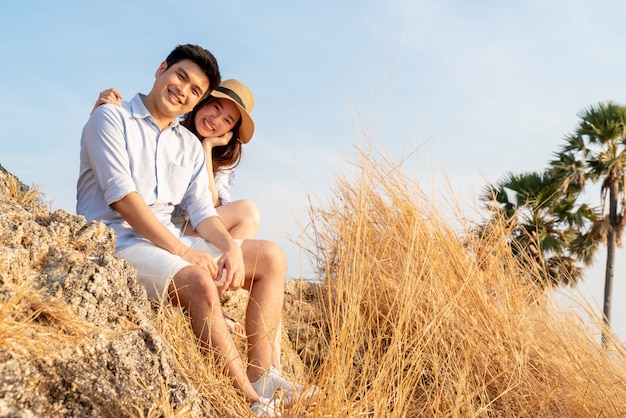 Happy young Asian couple in love having a good time