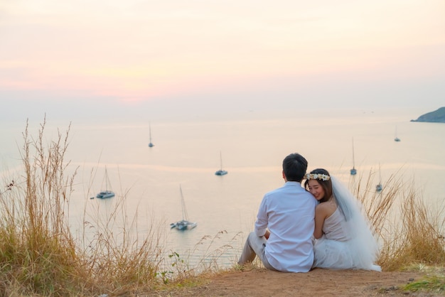 Happy young Asian couple in love having a good time