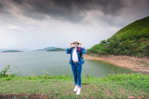 Happy young asian woman at Kang Kra Chan National Park Thailand