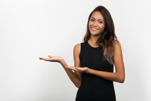 Happy young beautiful Asian woman with brown hair