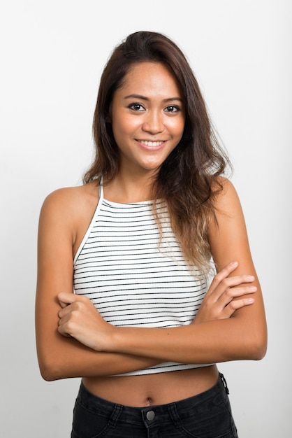 Happy young beautiful Asian woman with brown hair