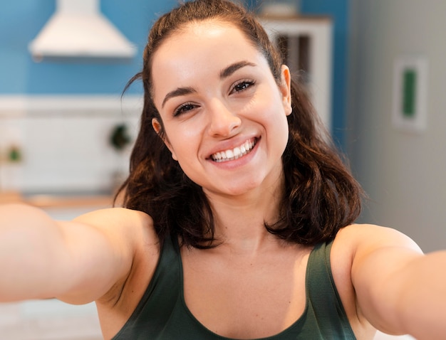 happy young blogger taking a selfie