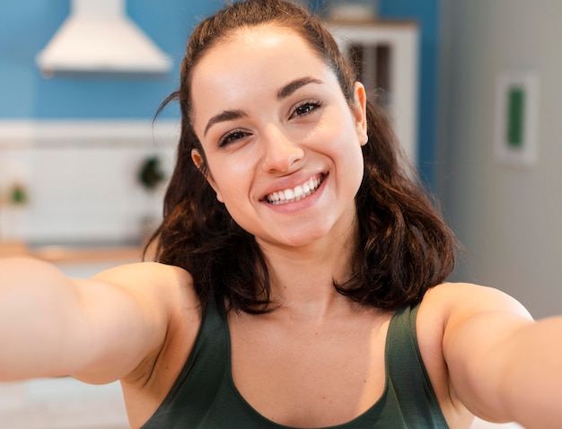 Happy young blogger taking a selfie