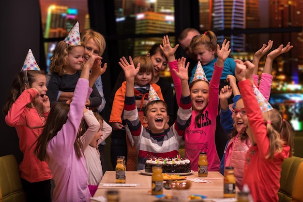 happy young boy having birthday party