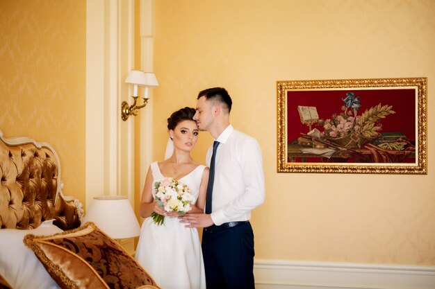 Happy young bride and groom on their wedding day