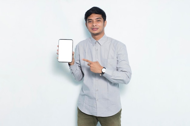 Happy young business man demonstrating mobile cell phone on white background