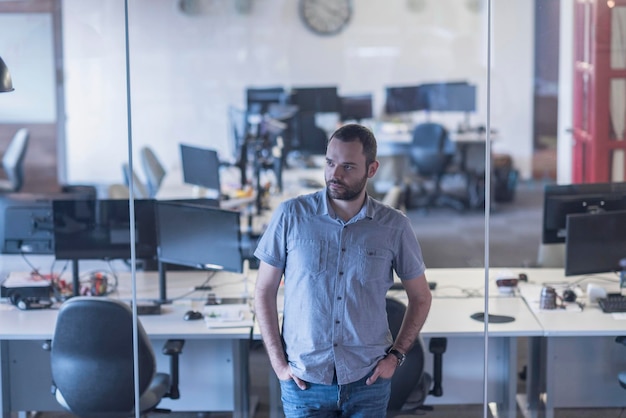 happy young business man at modern startup office