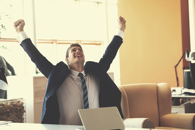 happy young business man portrait in bright modern office indoor