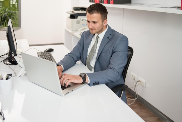 Happy Young Business Man Work In Modern Office On Computer