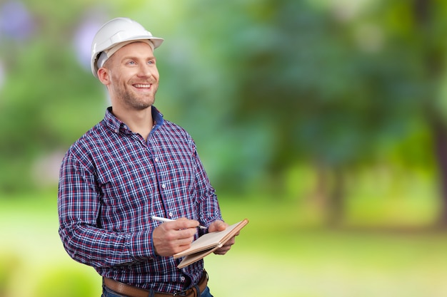 Happy young businessman architect smiling