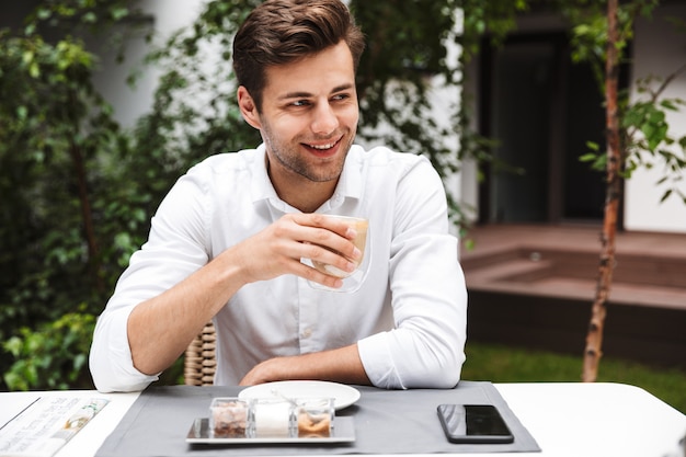 Happy young businessman dressed in shirt