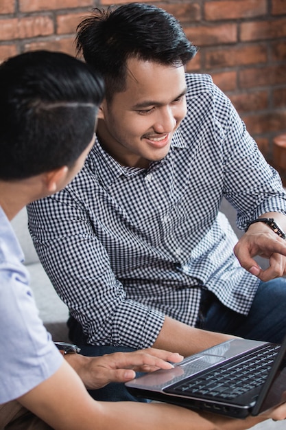 Happy young businessman meeting at home