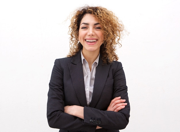 Happy young businesswoman against white background 