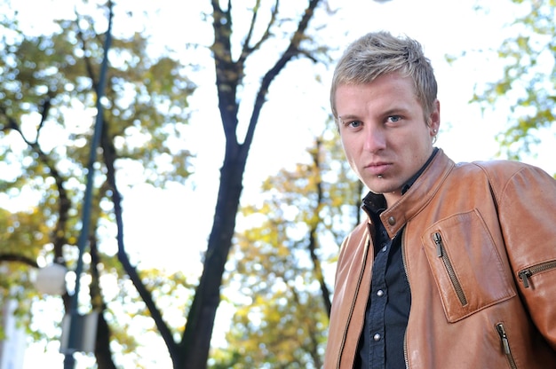 happy young casual man outdoor portrait posing