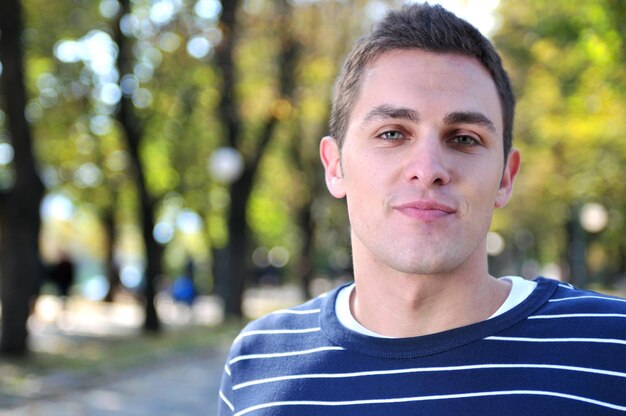 happy young casual man outdoor portrait posing