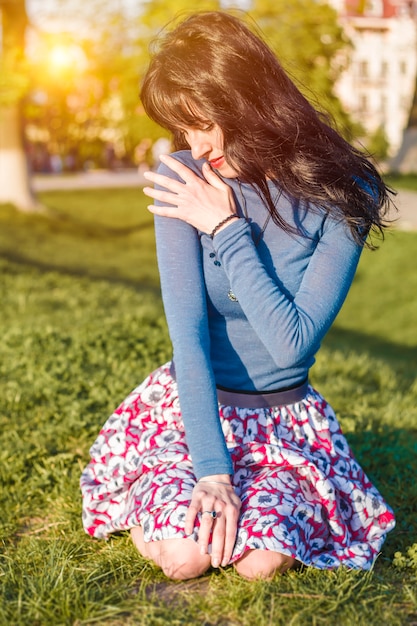 Happy young cheerful woman resting in nature.