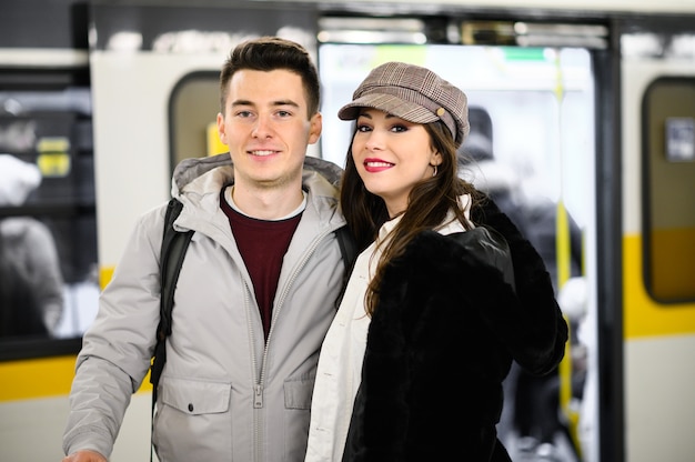 Happy young coulpe in the subway