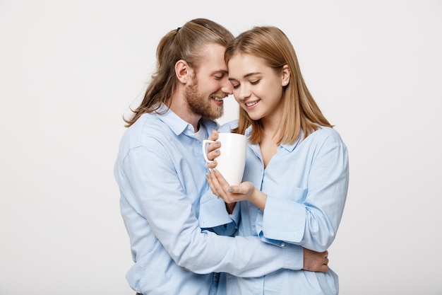 Photo happy young couple against white background