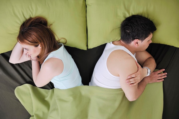 happy young couple in bed at morning