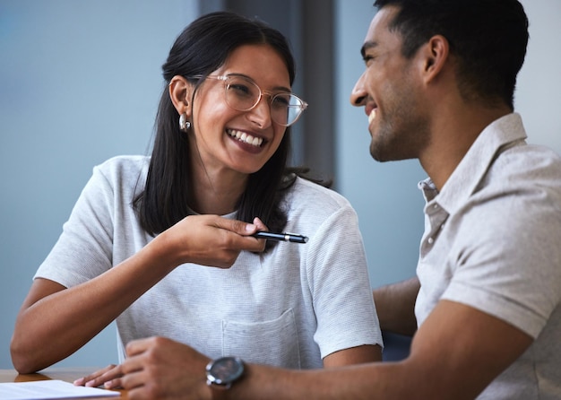 Happy young couple and documents with pen for signature financial investment or insurance for future Exited woman and man with smile discussion and paperwork to sign for house contract or loan