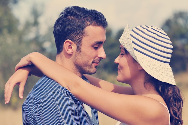 happy young couple have romantic time outdoor while smiling and hug