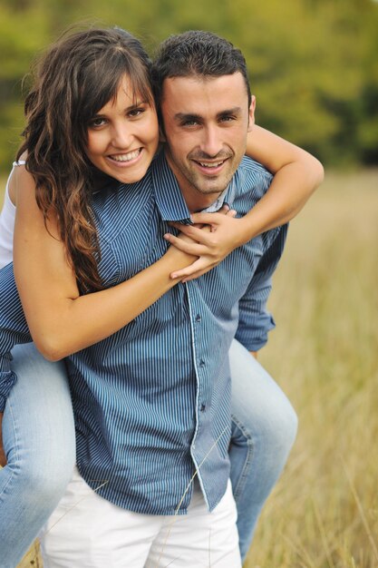 happy young couple have romantic time outdoor while smiling and hug