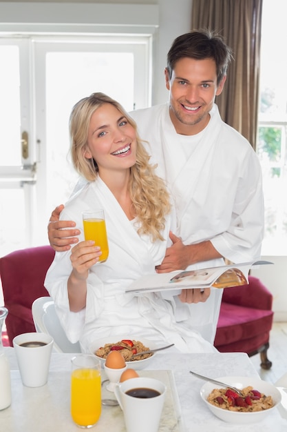 Happy young couple having breakfast