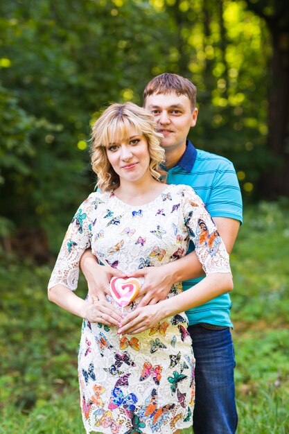 Happy and young couple hugging in nature