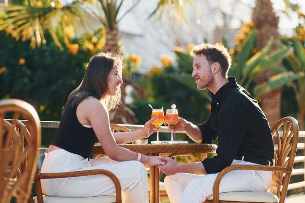 Happy young couple is together on their vacation Outdoors at sunny daytime