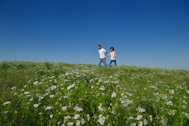 happy young couple in love have romance and fun at wheat field in summer