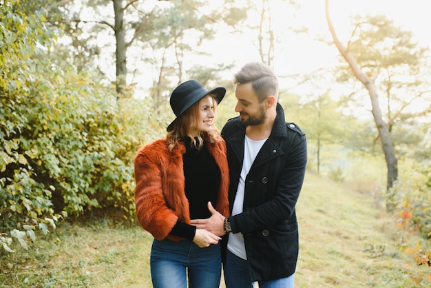 Happy young couple in love outdoor in autumn