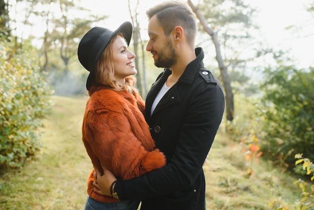 Happy young couple in love outdoor in autumn