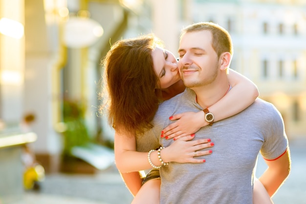 Happy young couple in love posing in the city