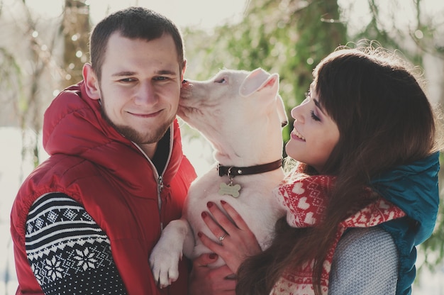 Happy young couple in love with a dog