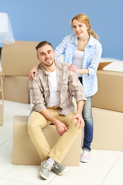 Happy young couple moving in their new apartment