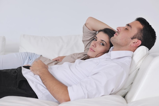 happy young couple relax at modern home living room indoor