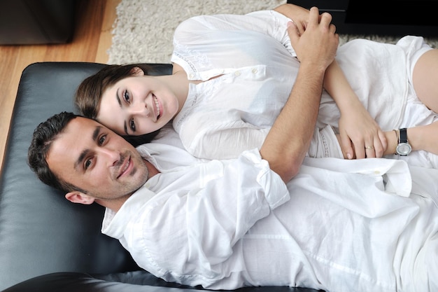 happy young couple relax at modern home livingroom indoor